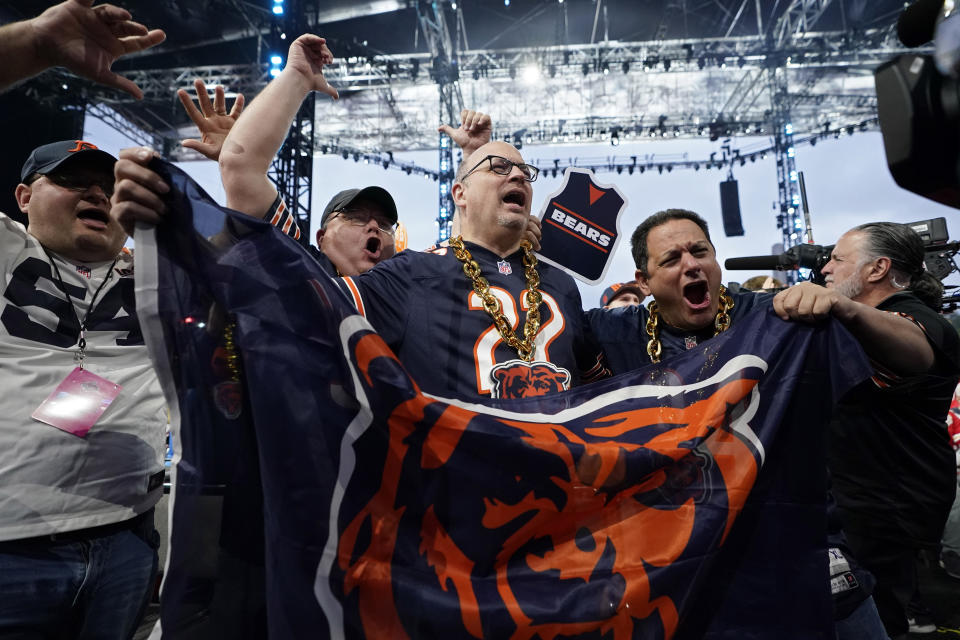Chicago Bears fans cheer during the second round of the NFL football draft, Friday, April 28, 2023, in Kansas City, Mo. (AP Photo/Charlie Riedel)