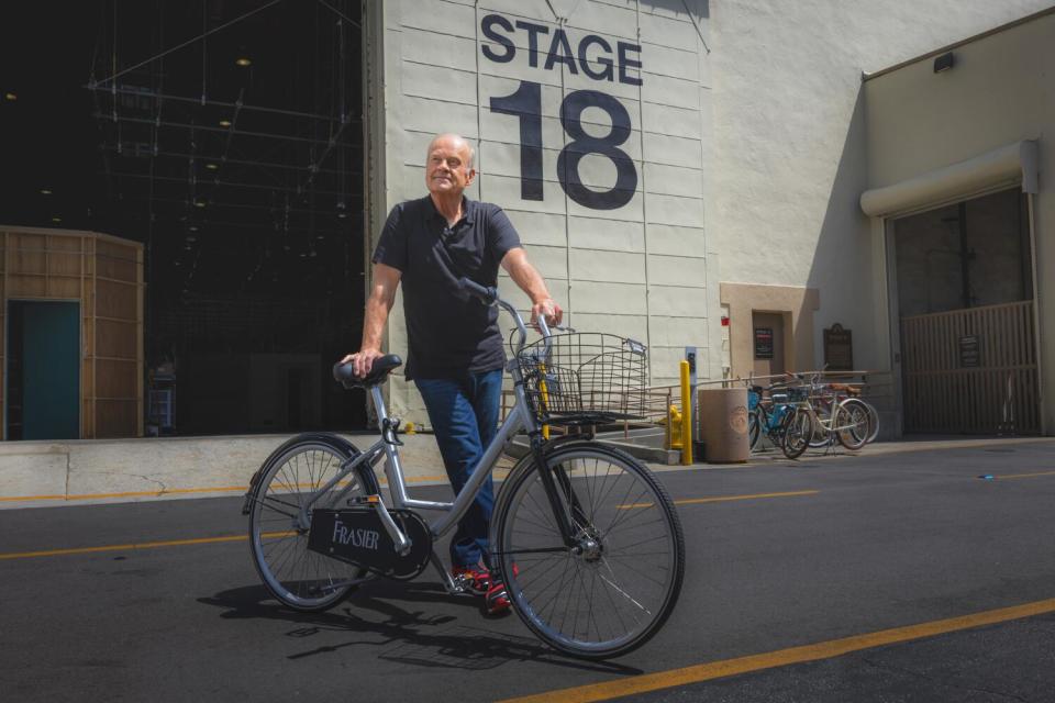 Kelsey Grammer stands with a bicycle outside Paramount Studios' Stage 18, where the new "Frasier" series is shot.