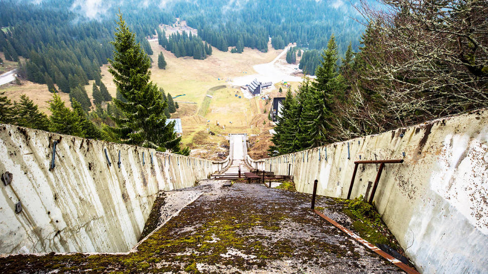 The giant ski jump, pictured here lying in wrack and ruin.