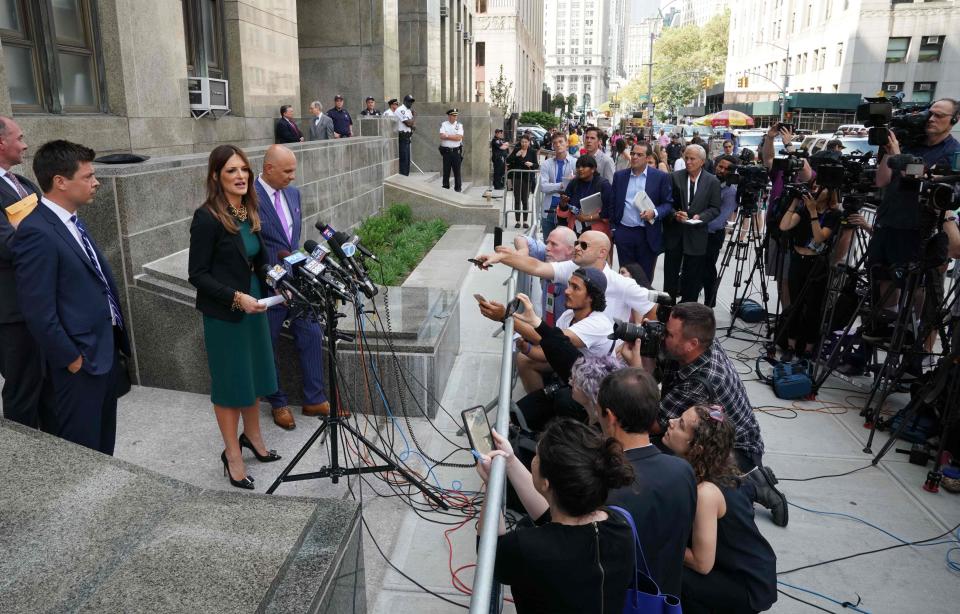 Harvey Weinstein's lawyers, including Donna Rotunno (C).  talk to reporters after his hearing July 11, 2019.