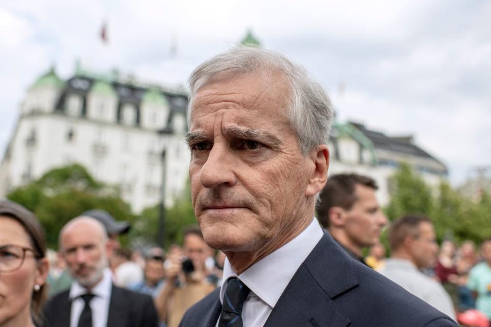 The Norwegian Prime Minister Jonas Gahr Stoere addresses the press after visiting a makeshift memorial near the restaurant where two people were killed (Getty Images)