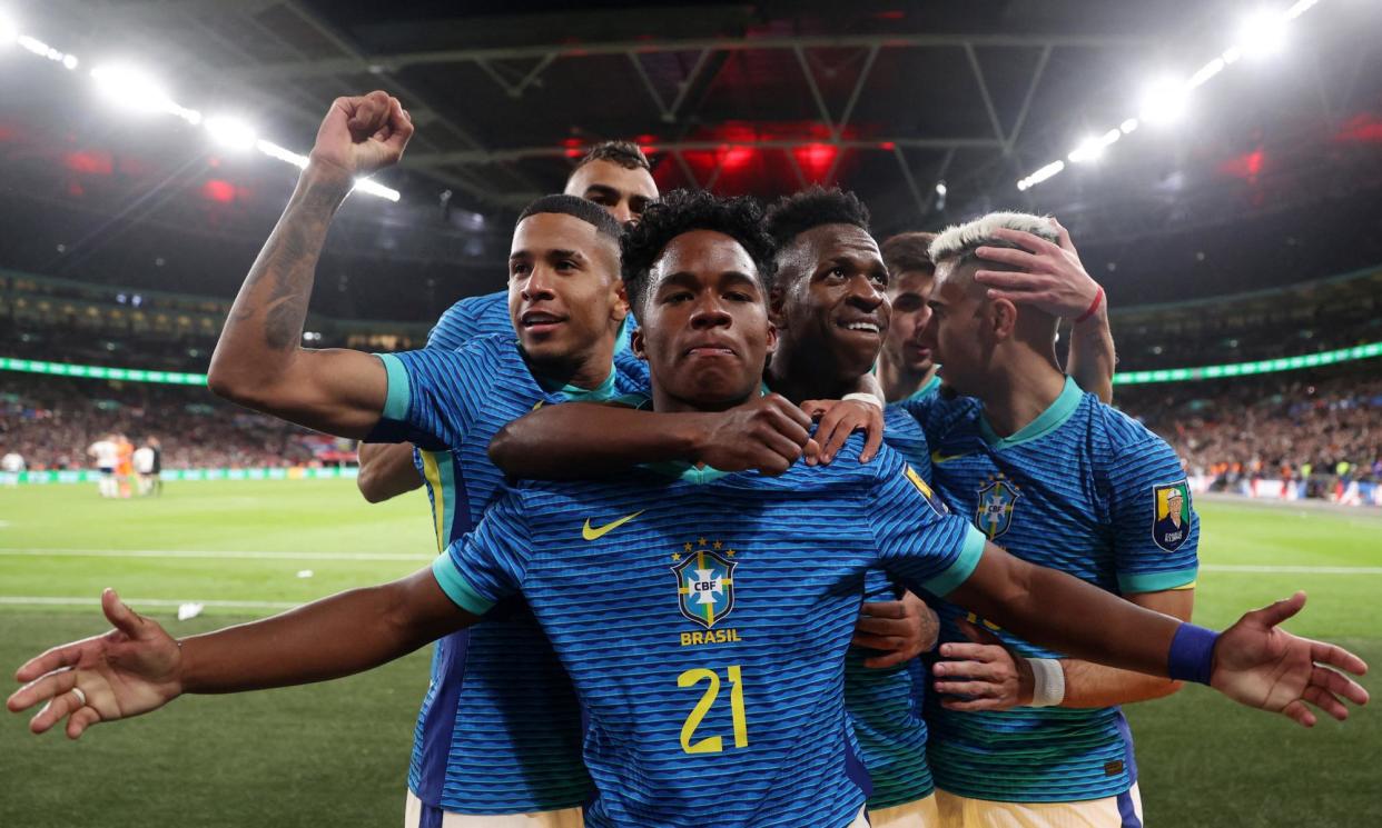 <span>Endrick celebrates with Vinícius Júnior and teammates after scoring against England.</span><span>Photograph: Carl Recine/Reuters</span>