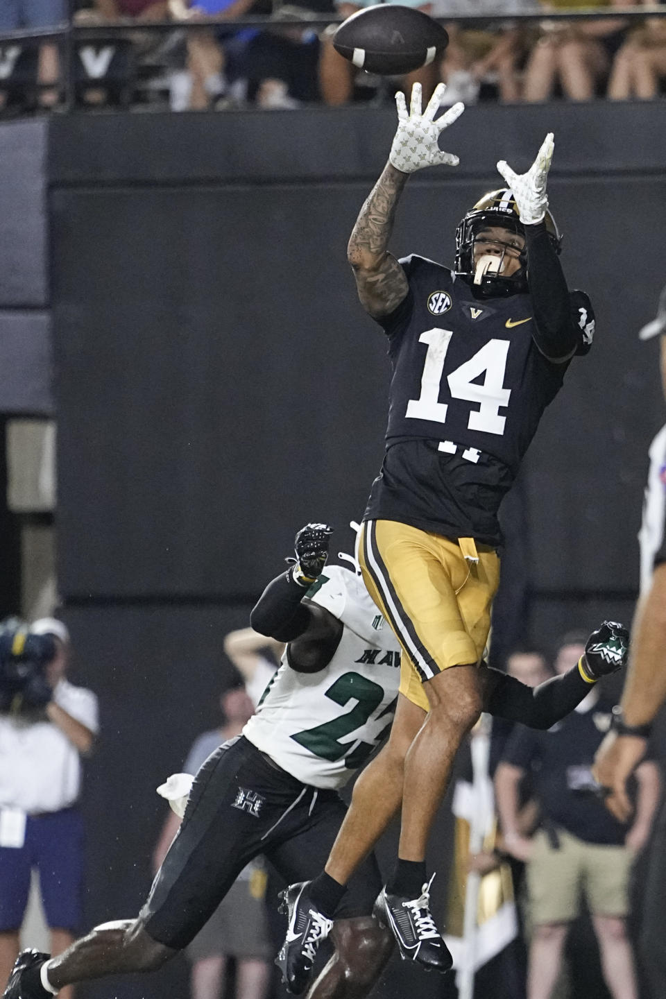 Vanderbilt wide receiver Will Sheppard (14) makes a touchdown catch over Hawaii defensive back Virdel Edwards II during the second half of an NCAA college football game Saturday, Aug. 26, 2023, in Nashville, Tenn. (AP Photo/George Walker IV)
