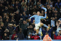 Manchester City's Erling Haaland celebrates after scoring his side's second goal from the penalty spot during the English Premier League soccer match between Manchester City and Fulham at Etihad stadium in Manchester, England, Saturday, Nov. 5, 2022. (AP Photo/Dave Thompson)