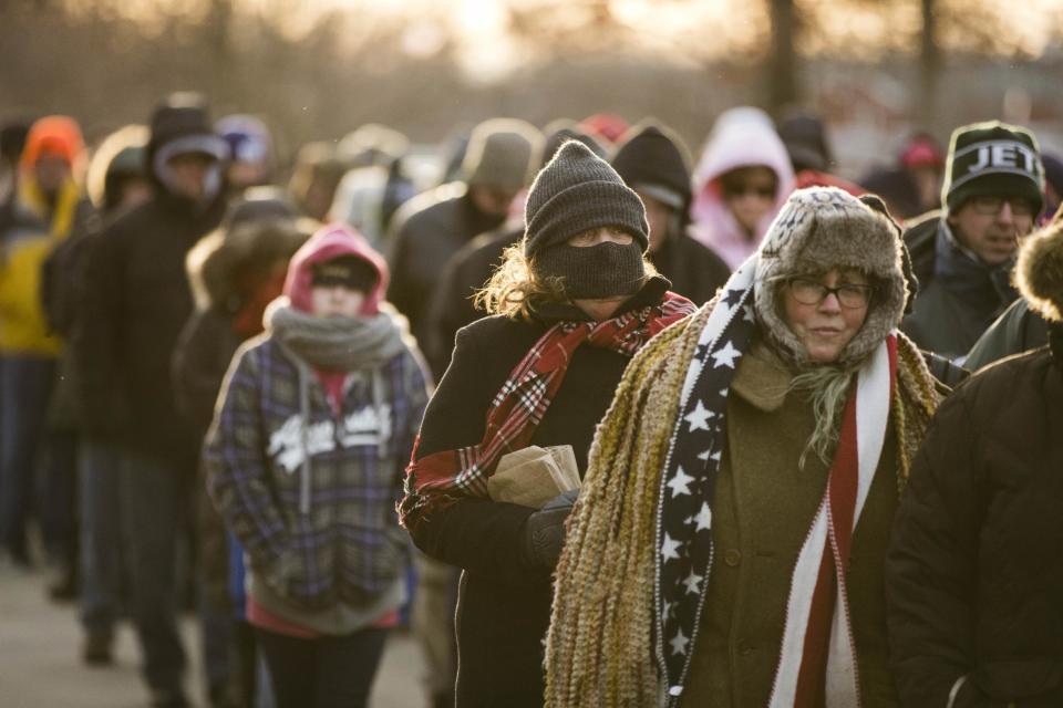 Attendees brave the cold as they wait in line to see President-elect Donald Trump and Vice-President-elect Mike Pence at a rally in Hershey, Pa., Thursday, Dec. 15, 2016. (AP Photo/Matt Rourke)