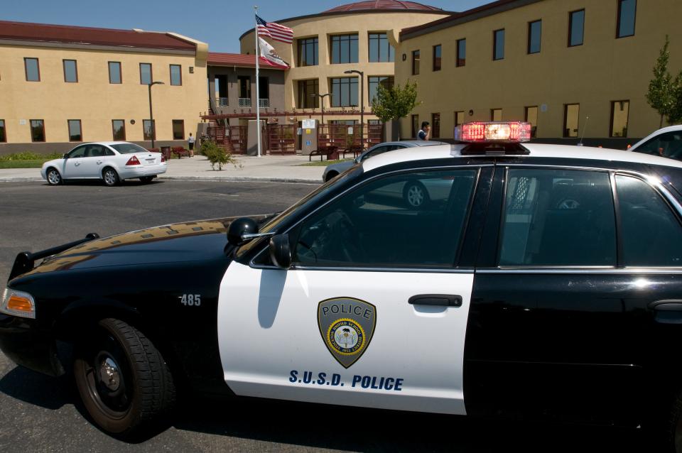 A SUSD police car blocks the entrance to Chavez High in 2009.  A 16-year-old boy was arrested Wednesday in Bakersfield for a threatening social media post directed at Cesar Chavez High School, according to Stockton Unified School District.