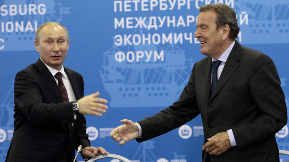 Vladimir Putin, left, with Gerhard Schröder