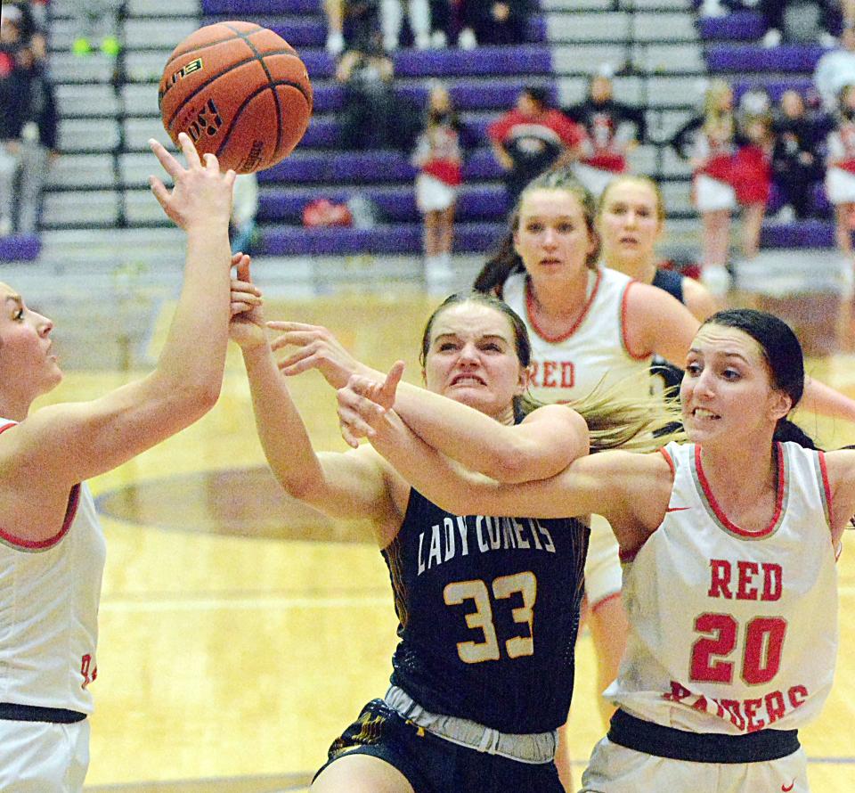 Rapid City Christian's Oliva Kieffer (33) puts up a shot against Wagner defenders Macy Koupal and Shalayne Nagel (20) during their first-round game in the state Class A high school girls basketball tournament on Thursday, March 9, 2023 in the Watertown Civic Arena.