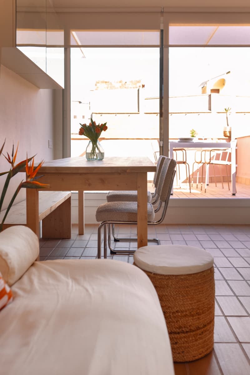 Dining table in sunny living area.