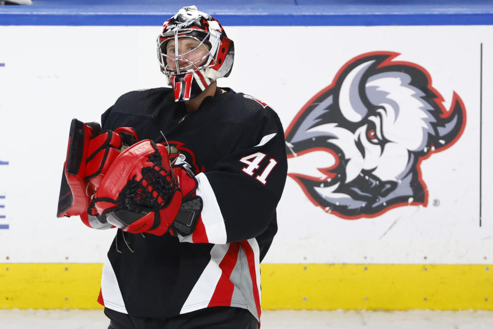 Buffalo Sabres goaltender Craig Anderson (41) celebrates after a victory following an overtime period of an NHL hockey game against the Ottawa Senators, Thursday, April 13, 2023, in Buffalo, N.Y. (AP Photo/Jeffrey T. Barnes)