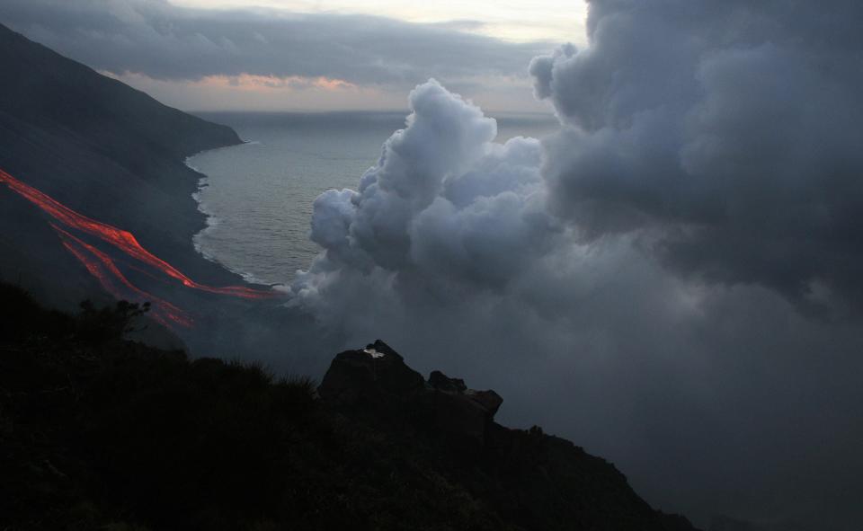 The Stromboli volcano north of Sicily spews lava towards the sea, Feb. 28, 2007. Stromboli attracts up to 6,000 tourists every year.
