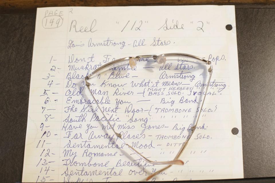 A written note and eyeglasses belonging to Louis Armstrong on display at the Louis Armstrong House Museum Wednesday, Oct. 9, 2013, in the Queens borough of New York. (AP Photo/Frank Franklin II)
