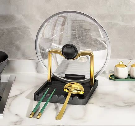 Keep utensils and pot lids clean and close by with this handy countertop holder