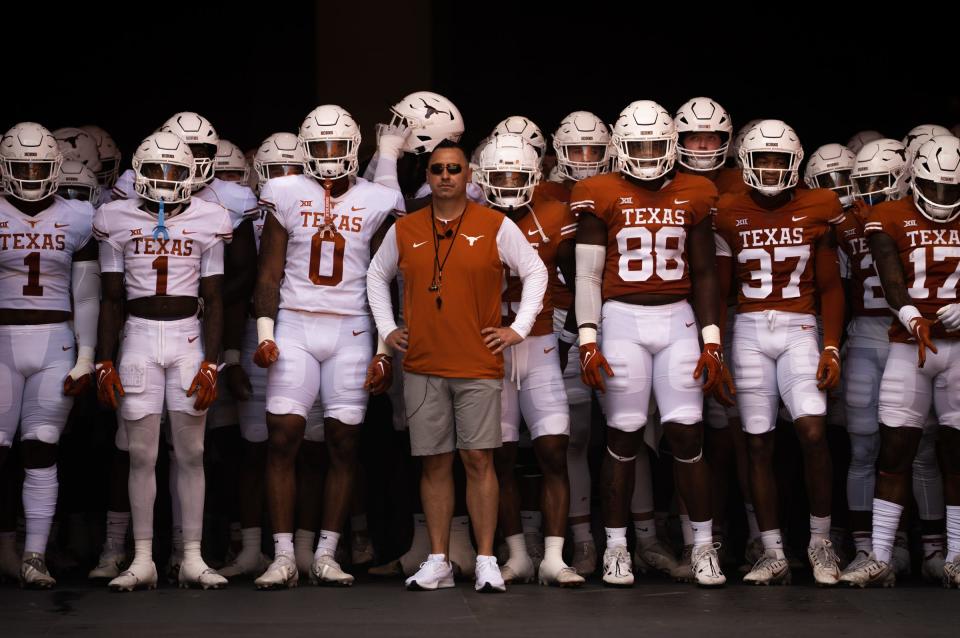 Texas coach Steve Sarkisian and his team wait ahead of the Longhorn's Orange and White spring football game at Royal-Memorial Stadium last spring. A stormy forecast threatens this Saturday's spring game.