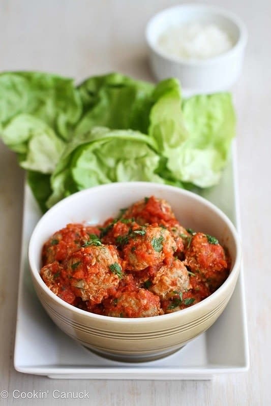 Baked Turkey, Quinoa, and Zucchini Meatballs in a bowl with Lettuce Wraps on the side