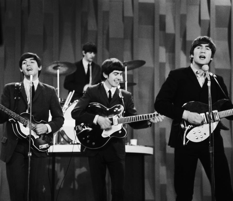 The Beatles, from left, Paul McCartney, Ringo Starr on drums, George Harrison and John Lennon on Feb. 9, 1964 in New York, as they record a set that would later be shown on the Feb. 23 broadcast of the 