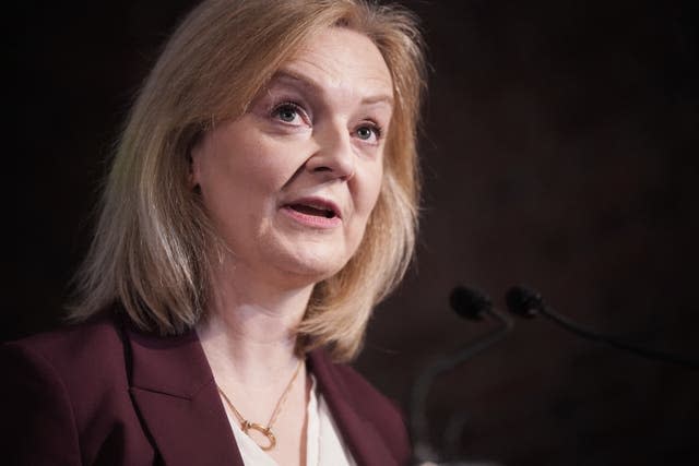 Liz Truss looks upwards as she speaks to a crowd