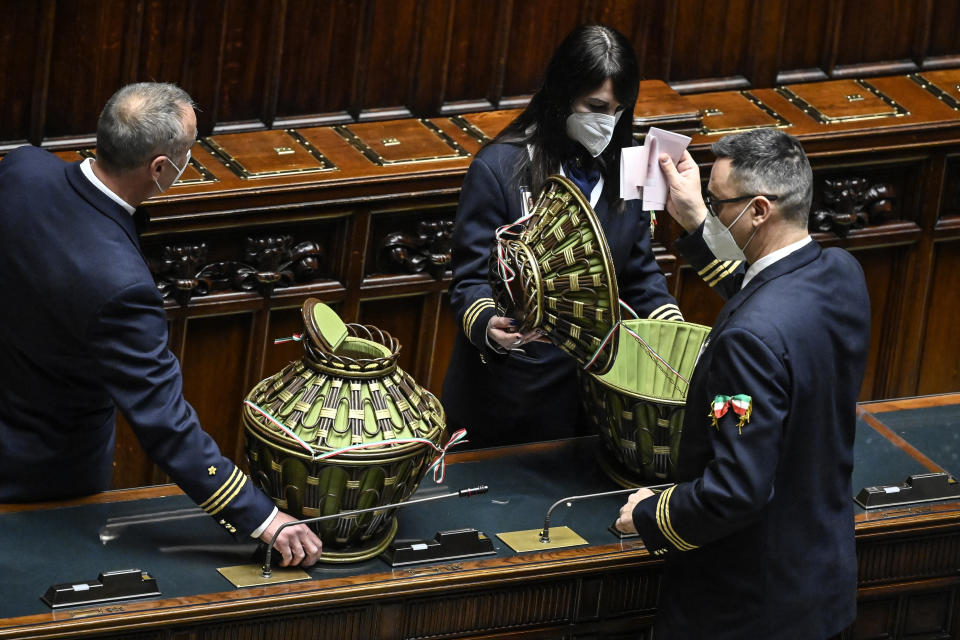 Ballots are counted in the Italian parliament in Rome, Wednesday, Jan. 26, 2022. The first two rounds of voting in Italy's Parliament for the country's next president yielded an avalanche of blank ballots, as lawmakers and special regional electors failed to deliver a winner amid a political stalemate. (Alberto Pizzoli/Pool photo via AP)