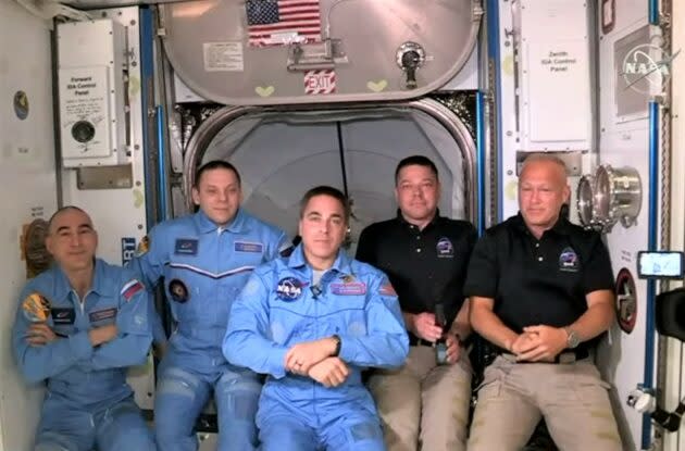 Space station and Crew Dragon astronauts