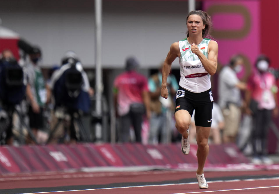 FILE In this file photo taken on Friday, July 30, 2021, Krystsina Tsimanouskaya, of Belarus, runs in action in the women's 100-meter race at the 2020 Summer Olympics. A feud between Tsimanouskaya and team officials that prompted her to seek refuge in Poland has again cast a spotlight on the repressive environment in the ex-Soviet nation, where authorities have unleashed a relentless crackdown on dissent. (AP Photo/Petr David Josek, File)