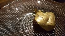 <p>“The Saison ‘Snickers’ bar. This is an off-menu item that comes if you befriend the right waiter. Some sort of dark chocolate and nut brownie base, salted caramel centre, chocolate ganache and topped with 24K gold.” <em>[Photo: Imgur]</em> </p>