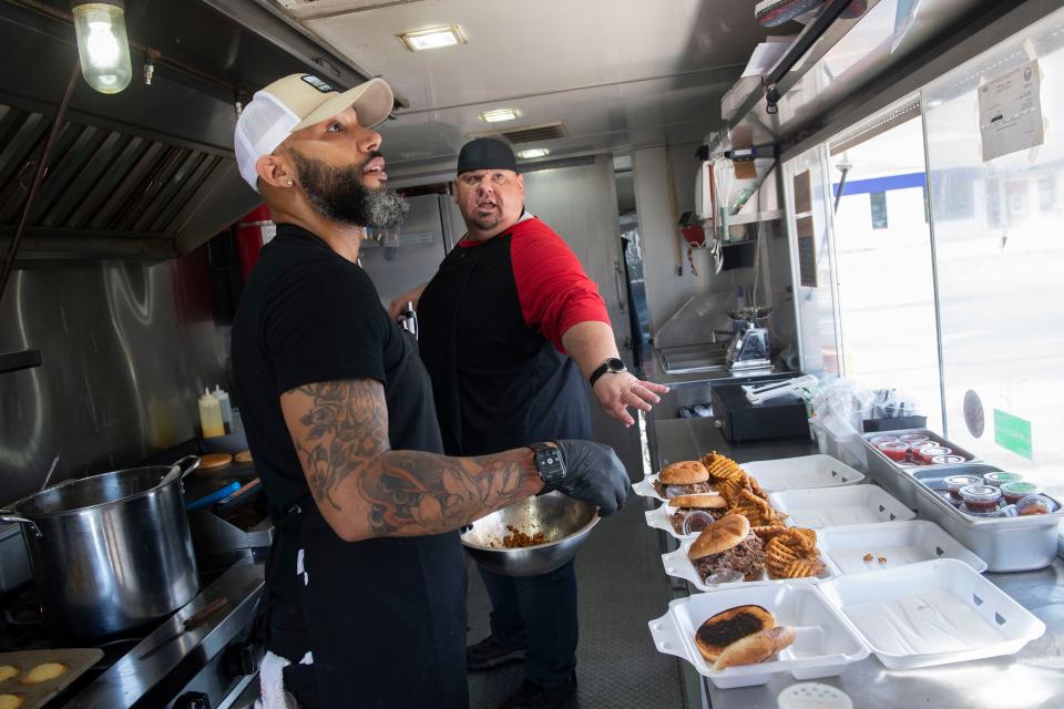 Pensacola Chef Edward Lordman and Big Moose manage the kitchen operation at the new Costello's Butcher Shop and Deli food truck on Wednesday, March 6, 2024.