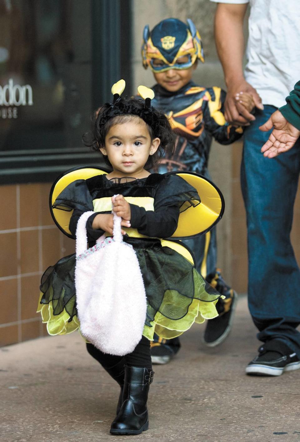 Families gathered for a special trick-or-treat atthe Thursday night Farmers Market on Higuera Street in downtown San Luis Obispo. Amy Marie Hernandez, 18 months, and brother Duvan, 4, hit the streets.