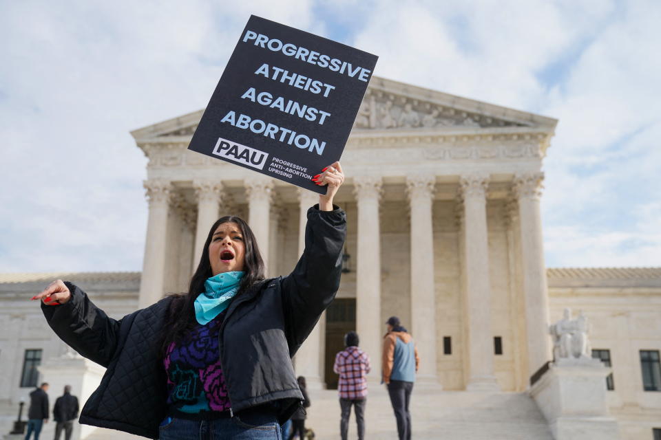 Anti-abortion activist Terrisa Bukovinac chants slogans after justices allowed abortion providers to pursue a legal challenge to a ban on most abortions in Texas, outside the U.S. Supreme Court in Washington, U.S., December 10, 2021. REUTERS/Sarah Silbiger