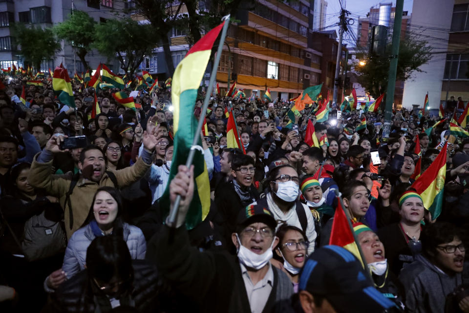 Anti-government protesters march against early presidential election results in La Paz, Bolivia, Tuesday, Oct. 22, 2019. International election monitors expressed concern over Bolivia's presidential election process Tuesday after an oddly delayed official quick count showed President Evo Morales near an outright first-round victory — even as a more formal tally tended to show him heading for a risky runoff. (AP Photo/Jorge Saenz)