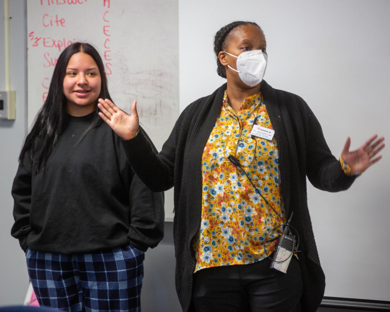 Highland Park High School assistant principal Michelle Lee shares what she learned about her partner Evelyn Aguilera, senior, during a Girl Up club warmup activity Thursday morning.