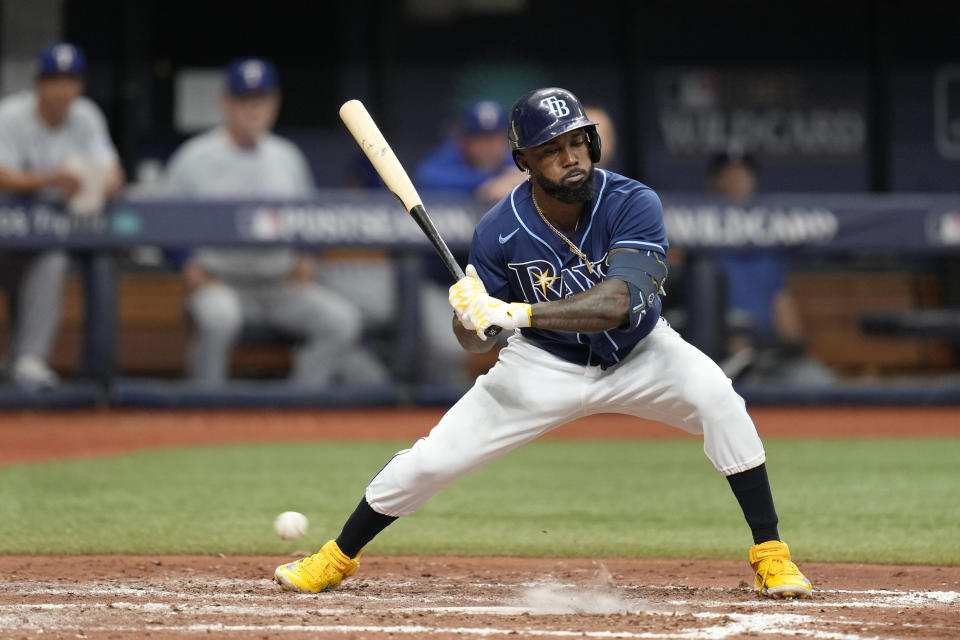 Tampa Bay Rays' Randy Arozarena holds his swing on a pitch in the dirt in the sixth inning of Game 2 in an AL wild-card baseball playoff series against the Texas Rangers, Wednesday, Oct. 4, 2023, in St. Petersburg, Fla. (AP Photo/John Raoux)