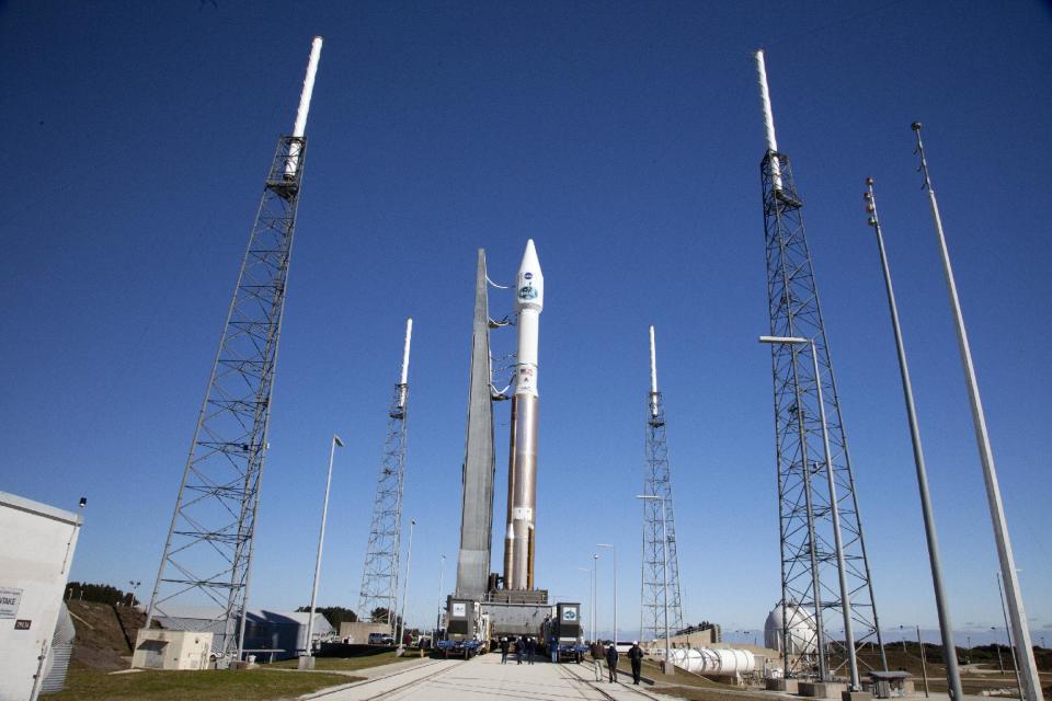 In a photo provided by NASA a United Launch Alliance Atlas V with TDRS-L atop, arrives at the launch pad at Cape Canaveral, Fla., Air Force Station's Launch Complex 41. The unmanned rocket is set to blast off Thursday night, Jan. 23, 2014, with the latest, third-generation Tracking and Data Relay Satellite. (AP Photo/Daniel Casper )