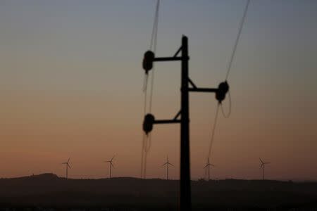 Electric power windmills and lines are seen on the outskirts of Lisbon, Portugal August 2, 2016. Picture taken August 2, 2016. REUTERS/Rafael Marchante