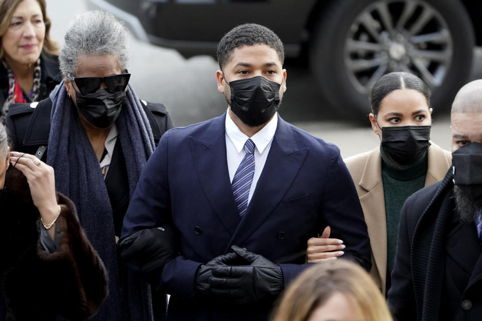 Actor Jussie Smollett walks with family members as they arrive Monday, Nov. 29, 2021, at the Leighton Criminal Courthouse for jury selection at his trial in Chicago. Smollett is accused of lying to police when he reported he was the victim of a racist, anti-gay attack in downtown Chicago nearly three years ago. (AP Photo/Charles Rex Arbogast)