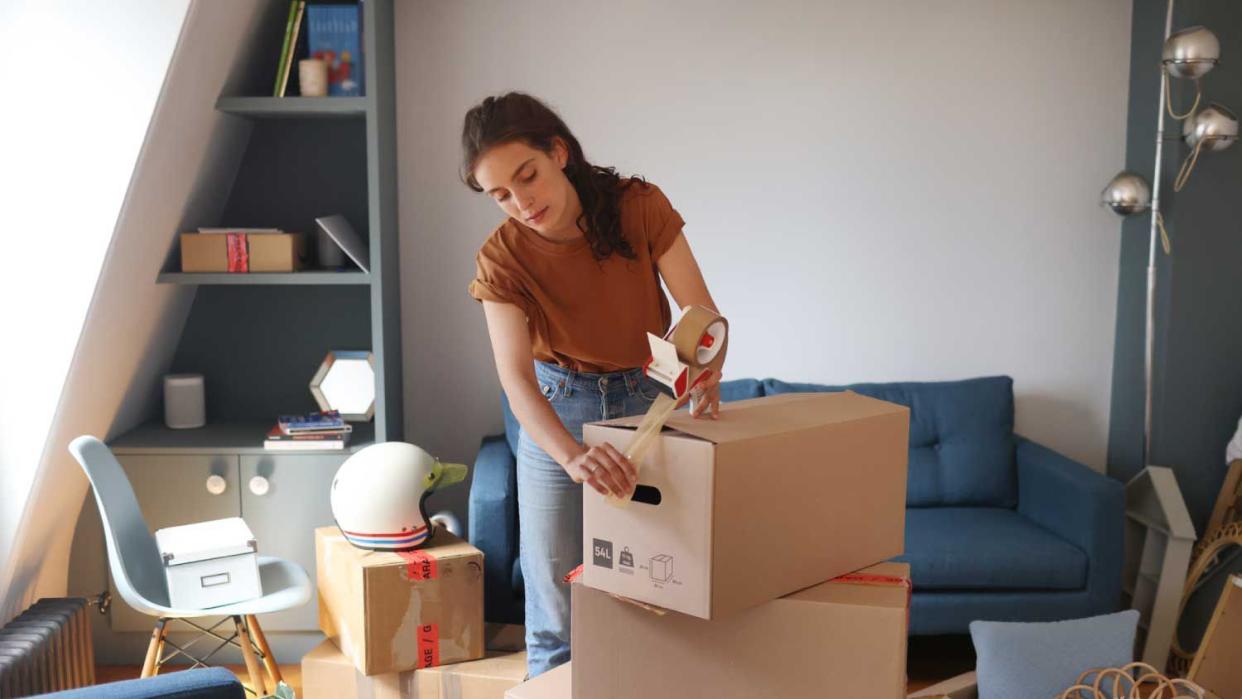 A woman decorating a room