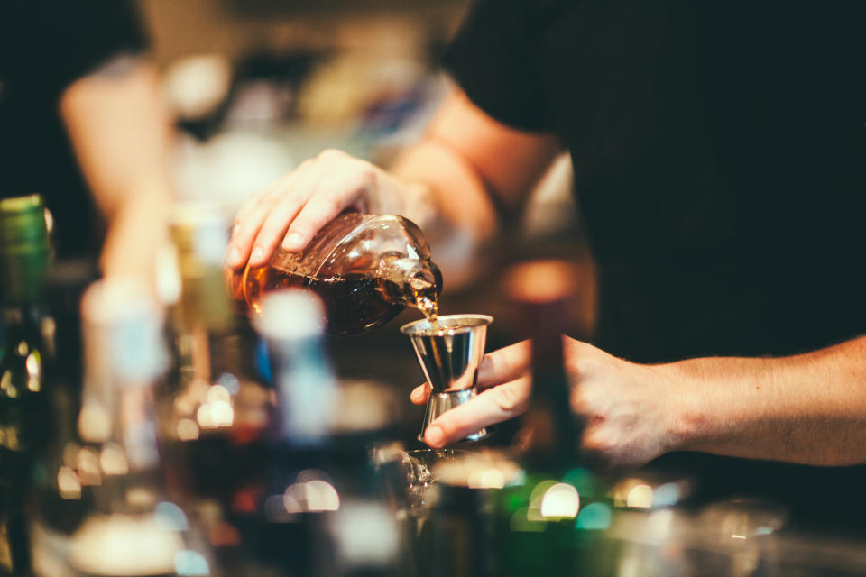 bartender pouring a drink