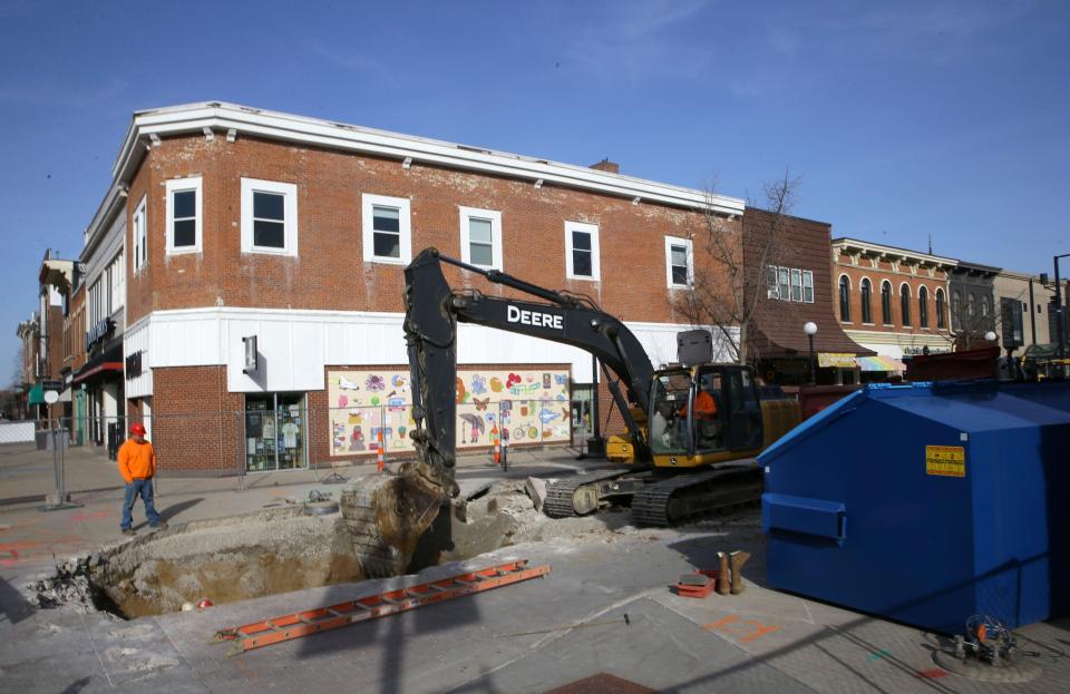 Workers begin reconstruction on Dubuque Street Tuesday, March 12, 2024 in downtown Iowa City, Iowa.