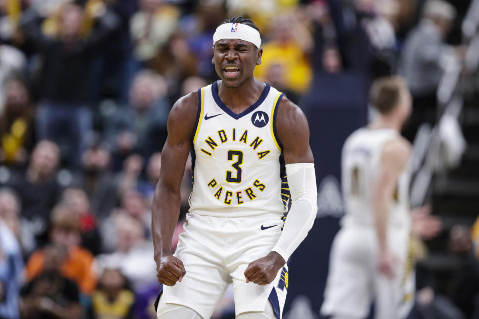 Indiana Pacers guard Aaron Holiday (3) celebrates a basket against the Los Angeles Lakers during the second half of an NBA basketball game in Indianapolis, Tuesday, Dec. 17, 2019. The Pacers defeated the Lakers 105-102. (AP Photo/Michael Conroy)