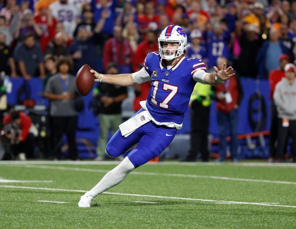 Buffalo Bills quarterback Josh Allen (17) finds running room against Tampa Bay. Allen rushed for 41-yards.