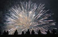 <p>Spectators watch a fireworks display on the east side of Manhattan, part of Independence Day festivities Wednesday, July 4, 2018, in New York. (Photo: Craig Ruttle/AP) </p>