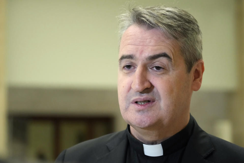 FILE - Rev. Andrew Small, a British-born Oblate of the Mary Immaculate priest, CEO of Missio Corp. speaks during a press conference at The Vatican, Saturday, March 25, 2023. The Vatican is seeking clarity after the former director of its U.S. missionary fundraising office oversaw the transfer of at least $17 million of its donations into a new non-profit and private equity fund that he created. (AP Photo/Alessandra Tarantino, File)