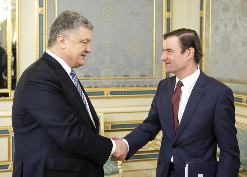 Ukrainian President Petro Poroshenko, left, and U.S. Undersecretary of State for Political Affairs David Hale shake hands during their meeting in Kiev, Ukraine, Wednesday, March 6, 2019. (Mikhail Palinchak, Presidential Press Service Pool Photo via AP)