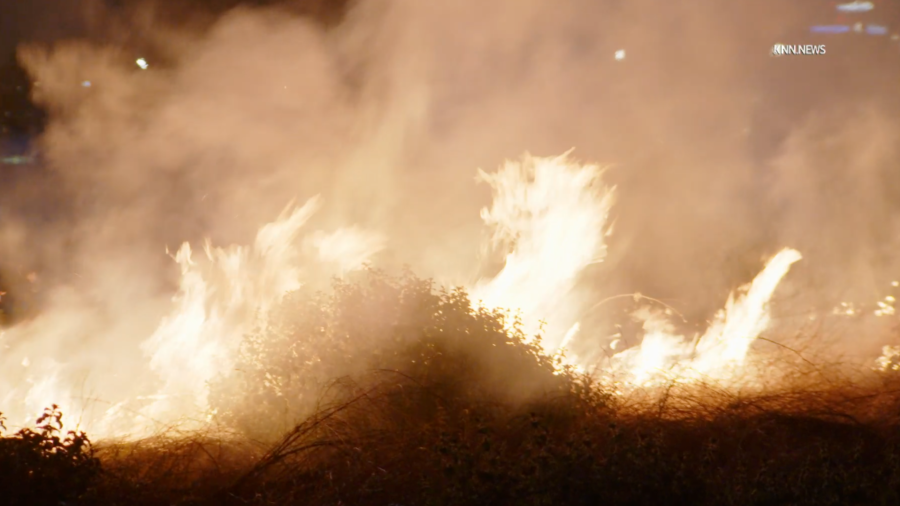 A brush fire burns in the Sepulveda Basin on May 5, 2024.