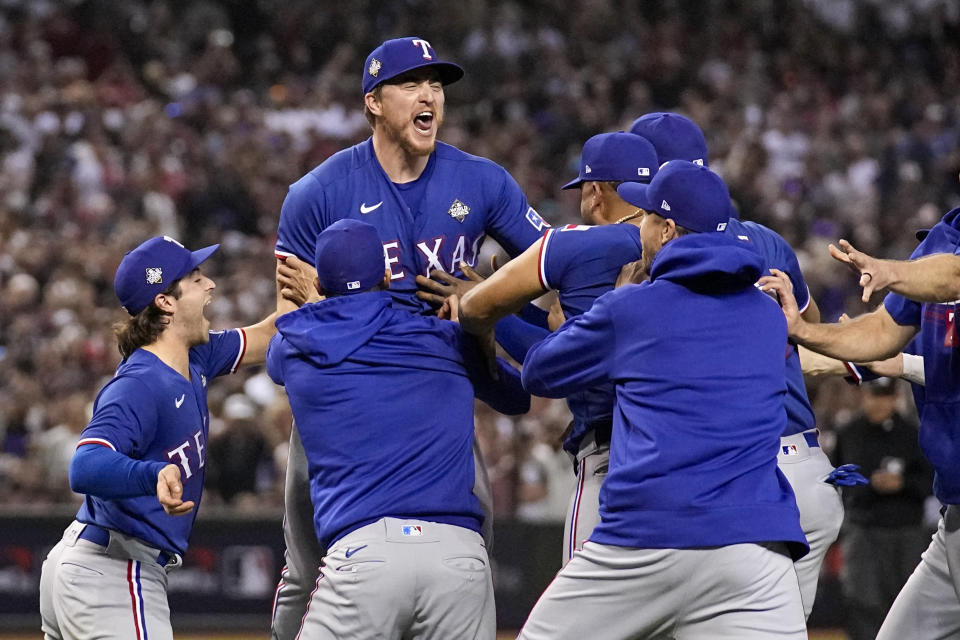 Texas Rangers celebrate after winning Game 5 of the baseball World Series against the Arizona Diamondbacks Wednesday, Nov. 1, 2023, in Phoenix. The Rangers won 5-0 to win the series 4-1. (AP Photo/Brynn Anderson)