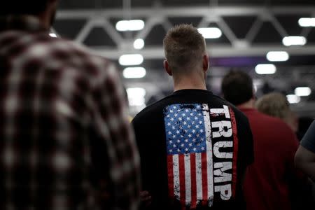 A man stands in the audience before Republican presidential nominee Donald Trump appears at a campaign rally in Manheim, Pennsylvania, U.S., October 1, 2016. REUTERS/Mike Segar