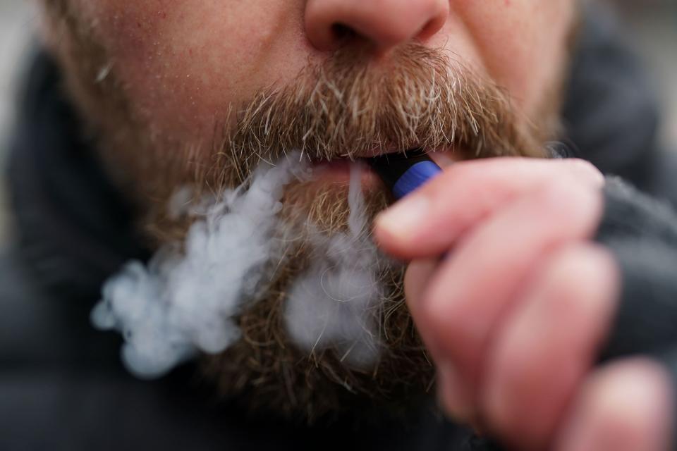 A man using a disposable vape (PA) (PA Wire)