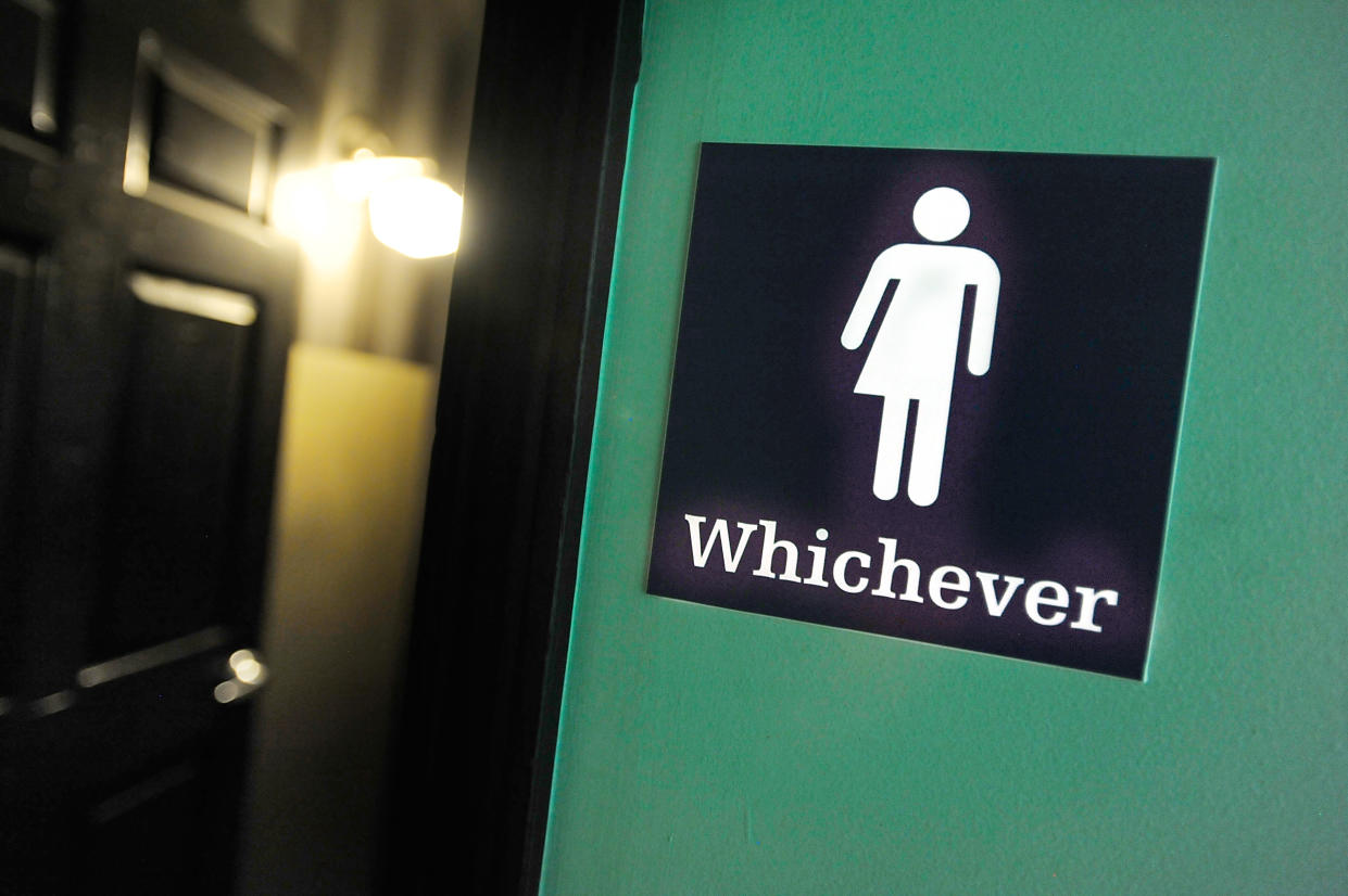 A gender neutral sign is posted outside a bathroom in Durham, N.C., in 2016. (Photo: Sara D. Davis/Getty Images)