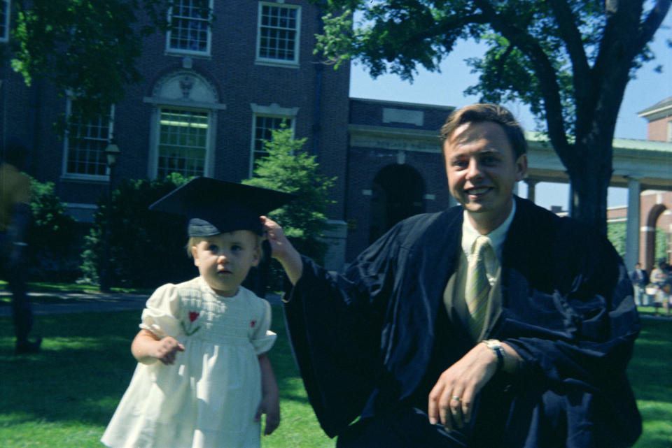 a dad and daughter at his graduation