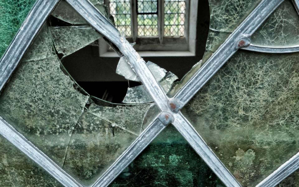 Vandals smashed windows with rocks at the medieval church