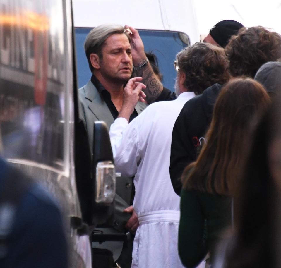 gerard butler with blond hair while filming in the hand of dante